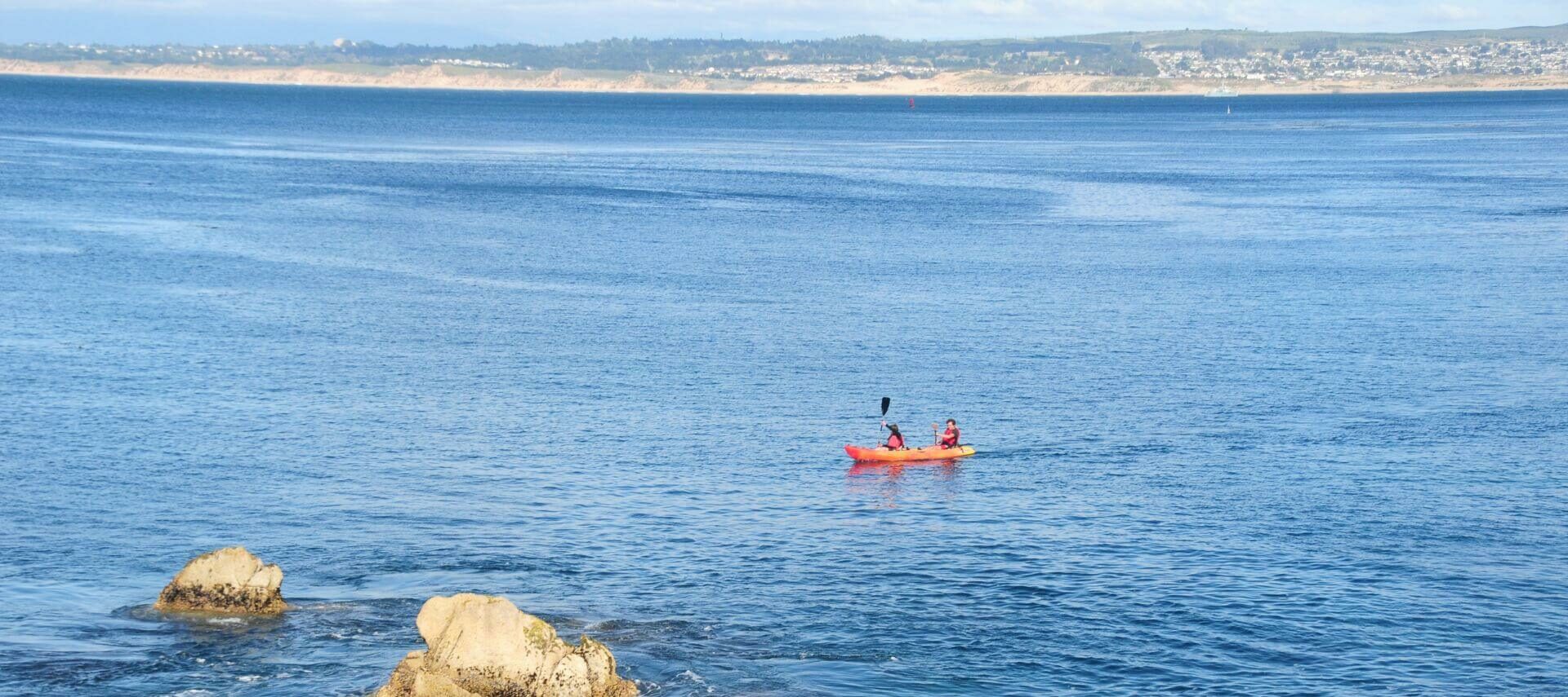 Two people kayaking in Monterey Bay, CA