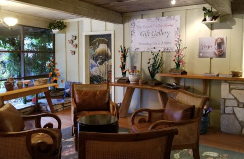 Entrance to Gift Gallery with leather and wicker chairs nestled around small table